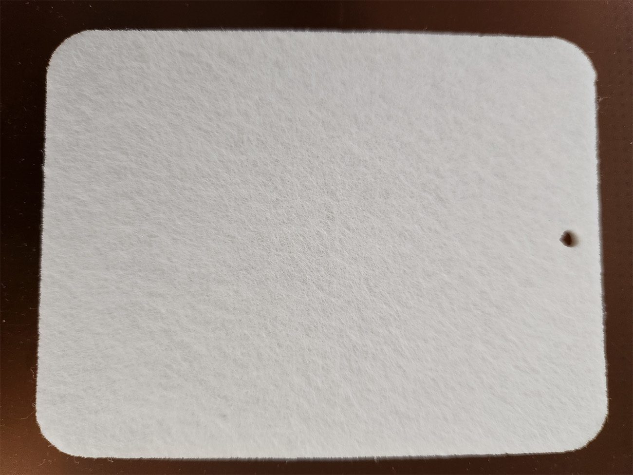 Close-up of white textured paper.