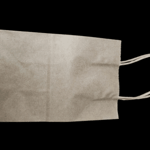 A plain brown paper bag with handles on a black background.