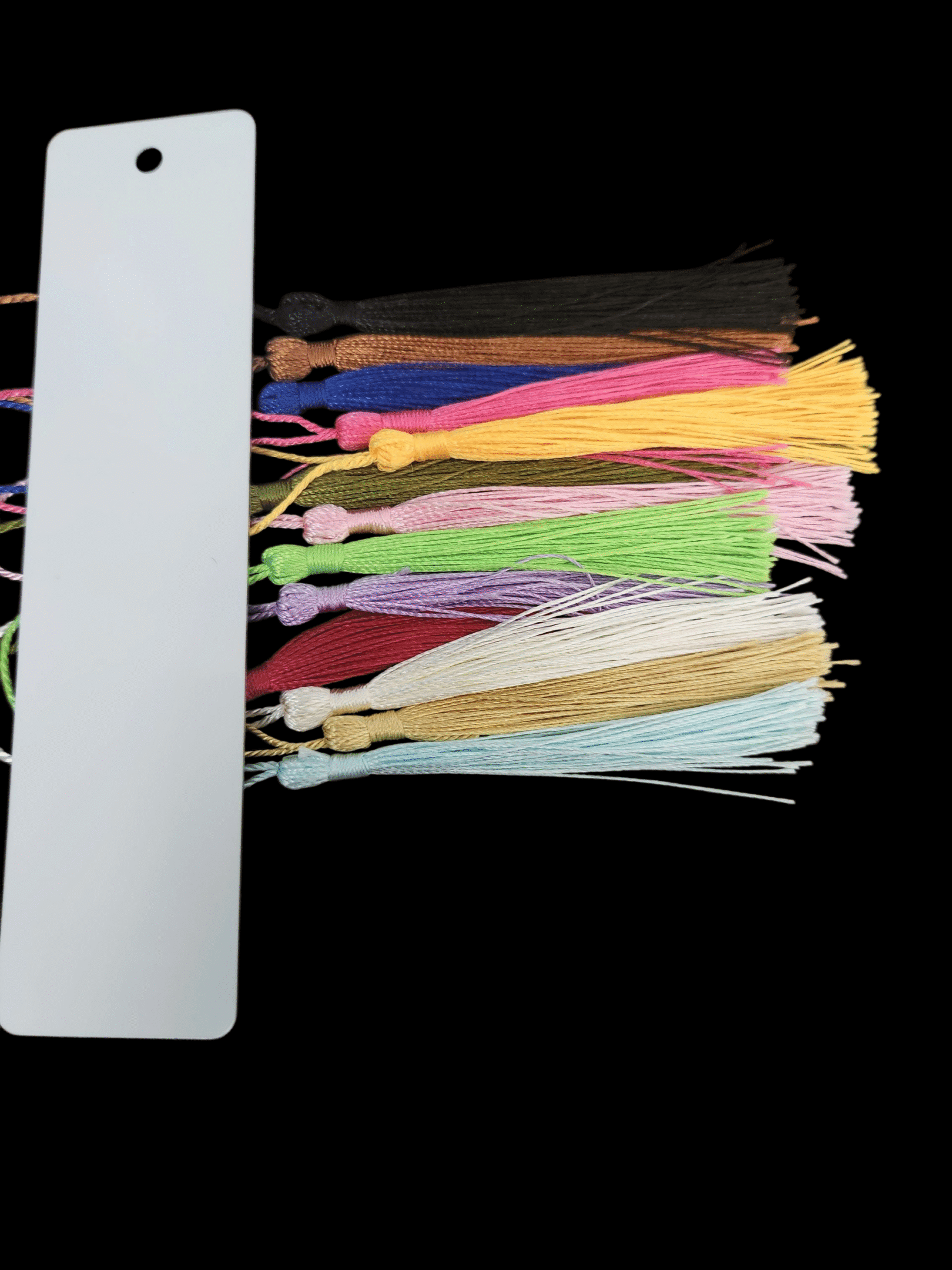 A color chart with multiple yarn strands in various pastel and bright colors.