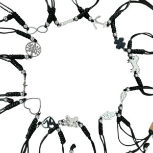 Circle of black leather harnesses with silver rings on a white background.