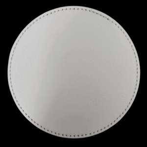 Top-down view of a circular, textured white object with stitching around the edges.