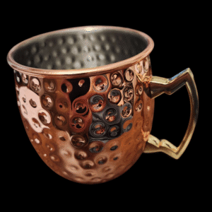 Copper mug with a textured surface and angular handle.