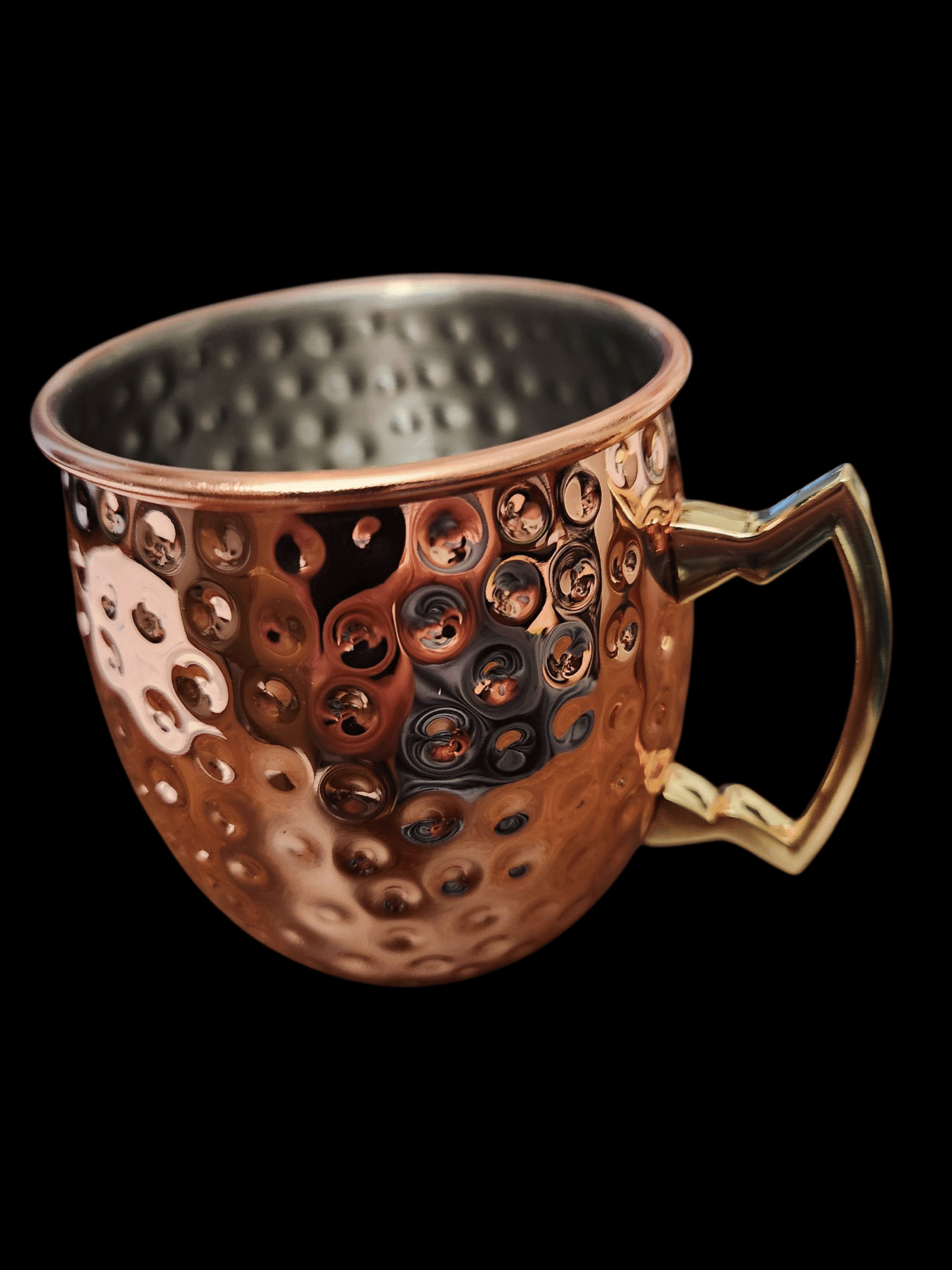 Copper mug with a textured surface and angular handle.