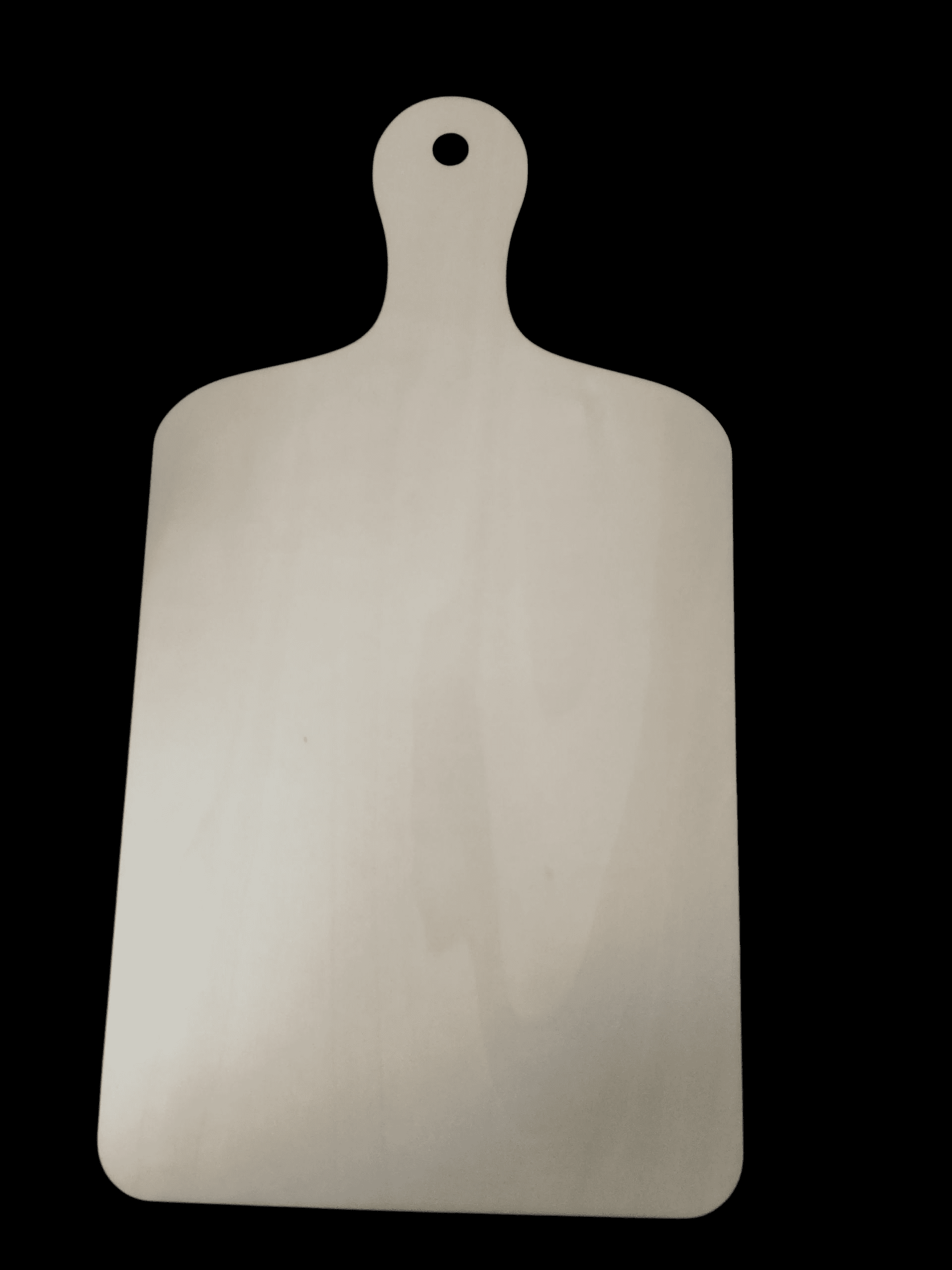 A wooden cutting board with a handle on a black background.
