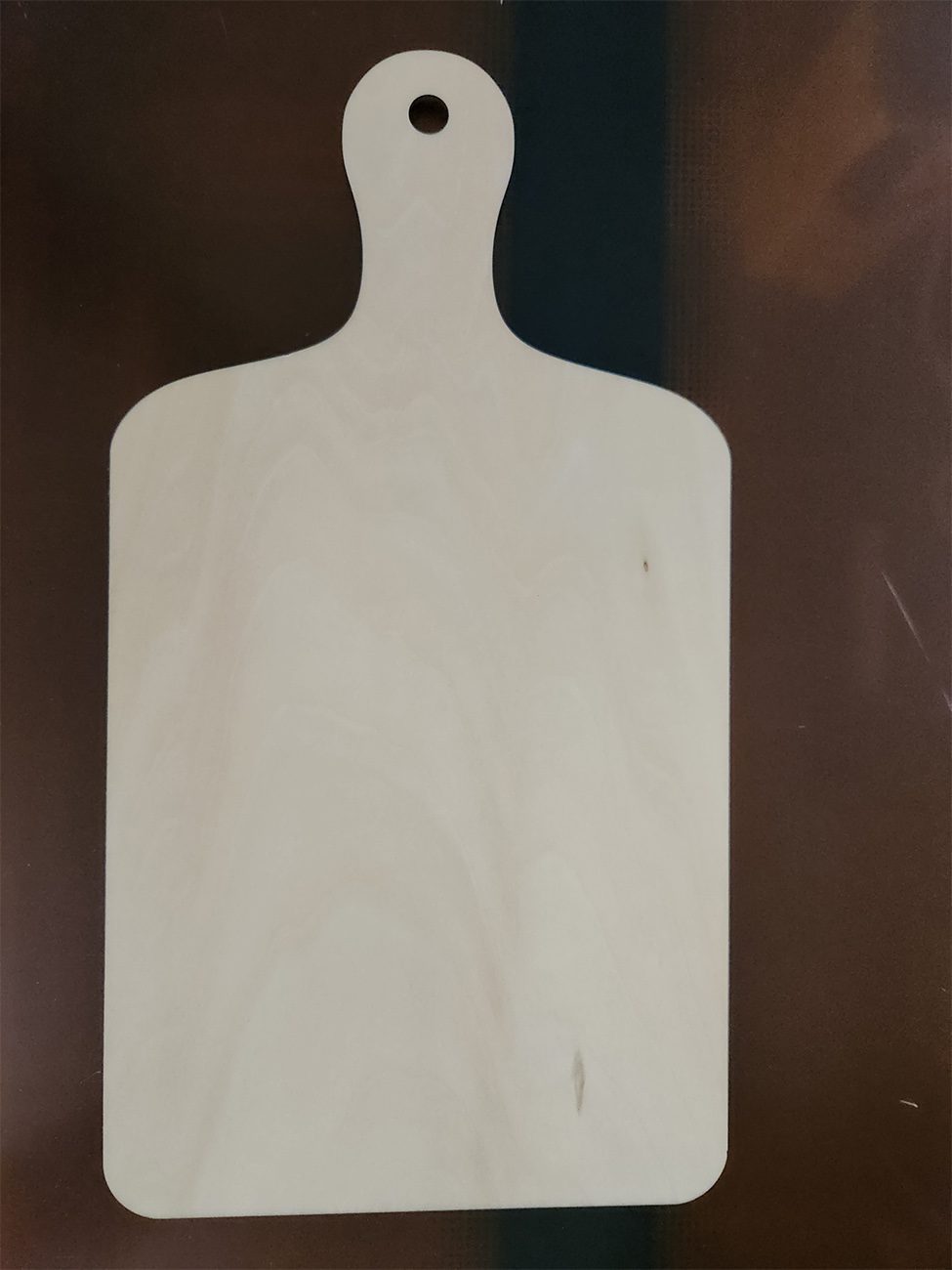 A white shooting target silhouette against a dark background.