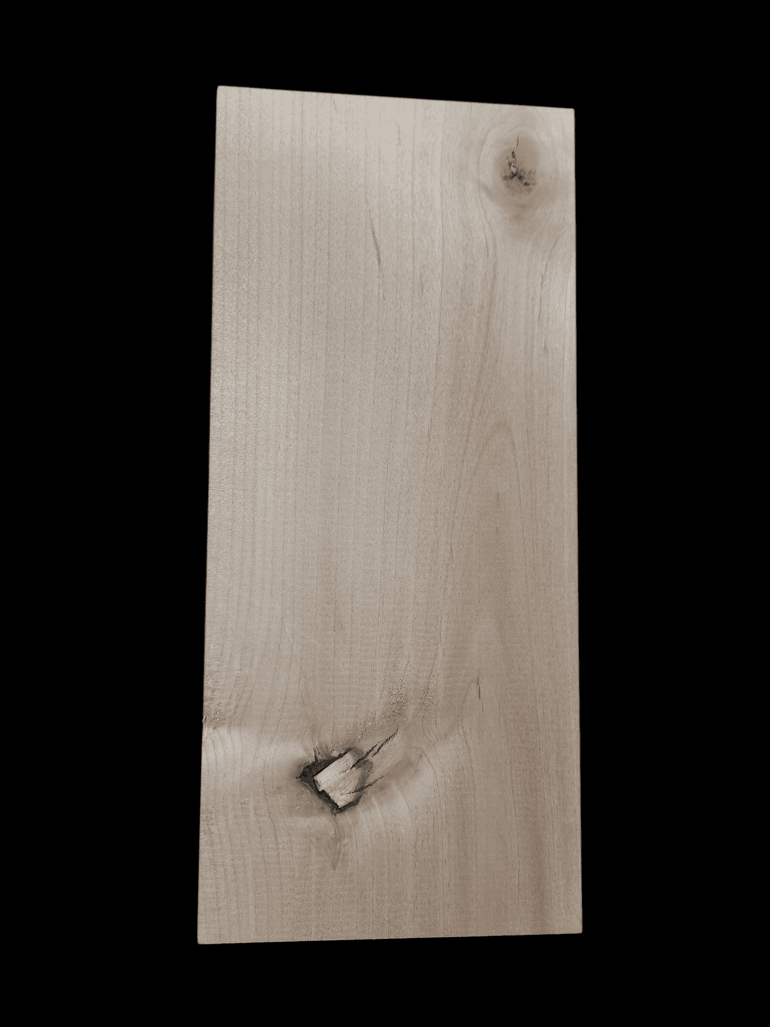 A wooden plank with natural knots and grain patterns.