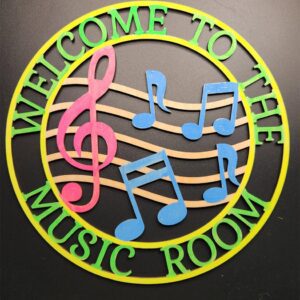 Colorful music-themed welcome sign with notes and treble clef.