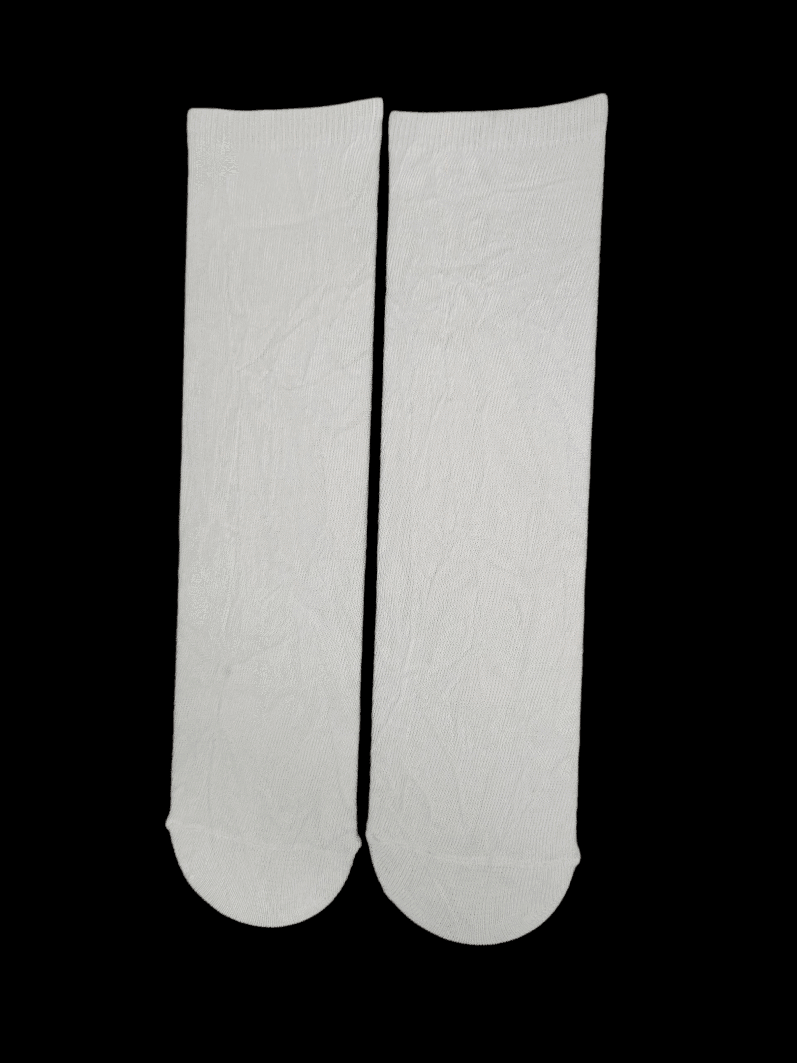 Close-up of two white adhesive bandages on a black background.