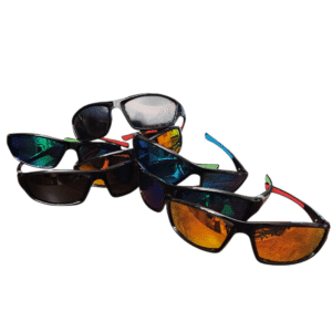 A pile of various sunglasses with different colored lenses.