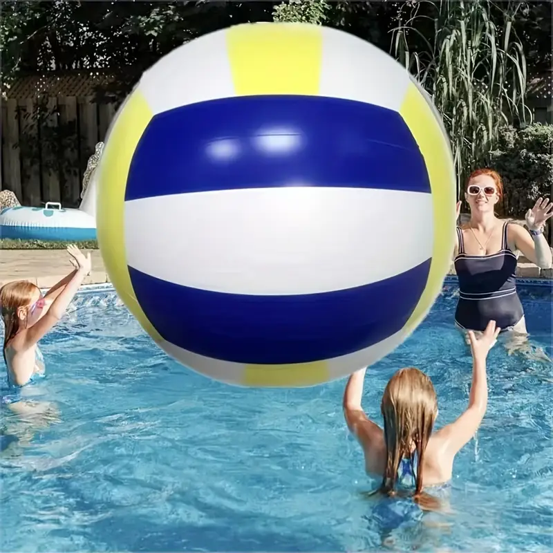 Children playing with a volleyball in a pool.