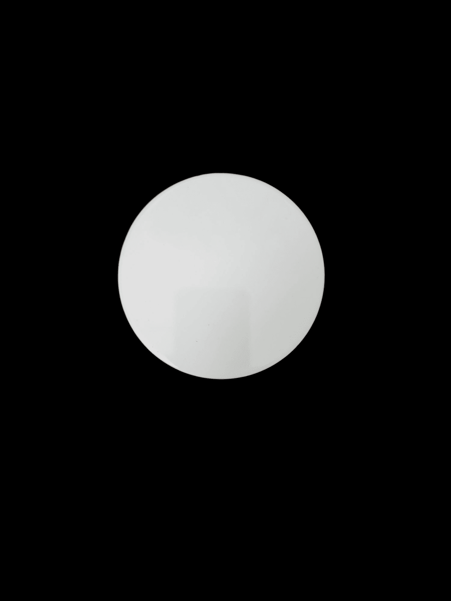 A glowing white orb pulsates softly against a black background.