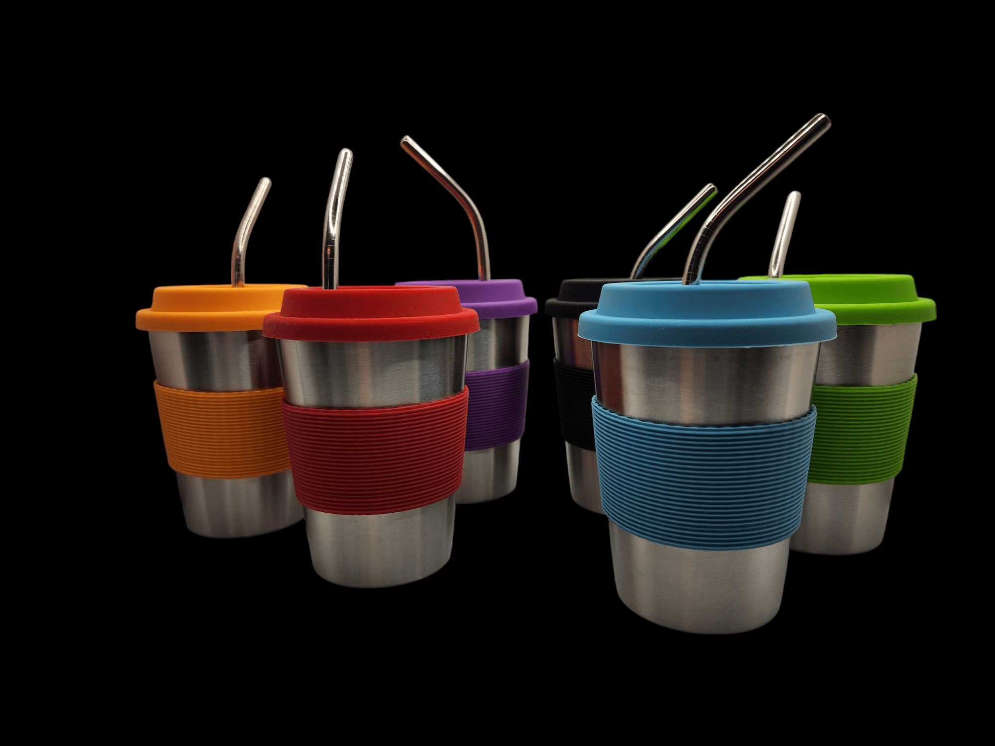 Reusable cups with colorful silicone sleeves and straws arranged in a row.