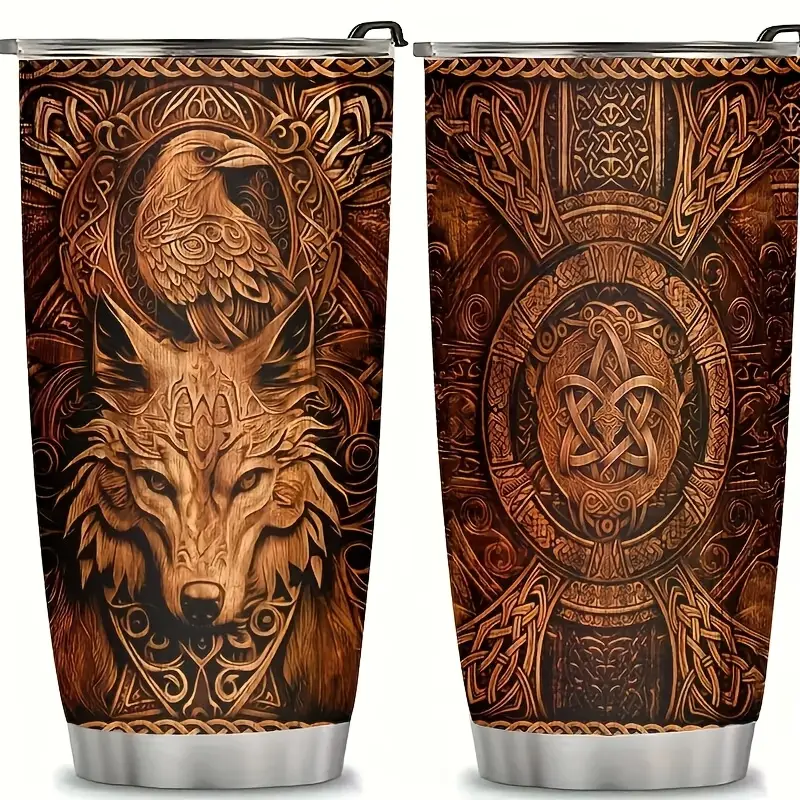 Tumbler with detailed tribal eagle and wolf designs.