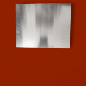 A blurred black and white abstract image on a red background.