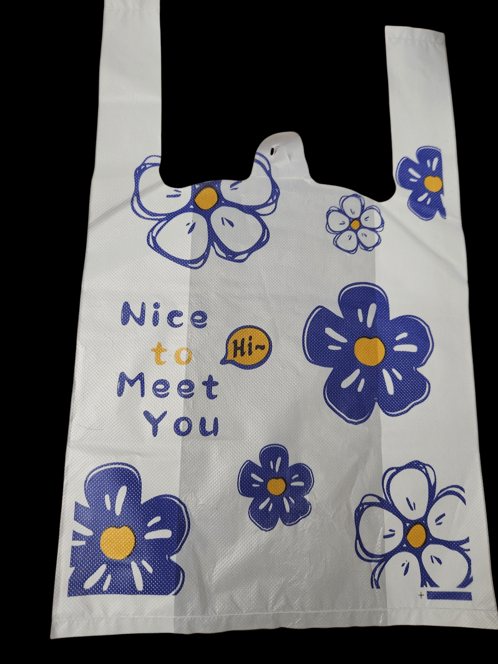A colorful bag with blue and yellow flowers and text saying 'Nice to Meet You'