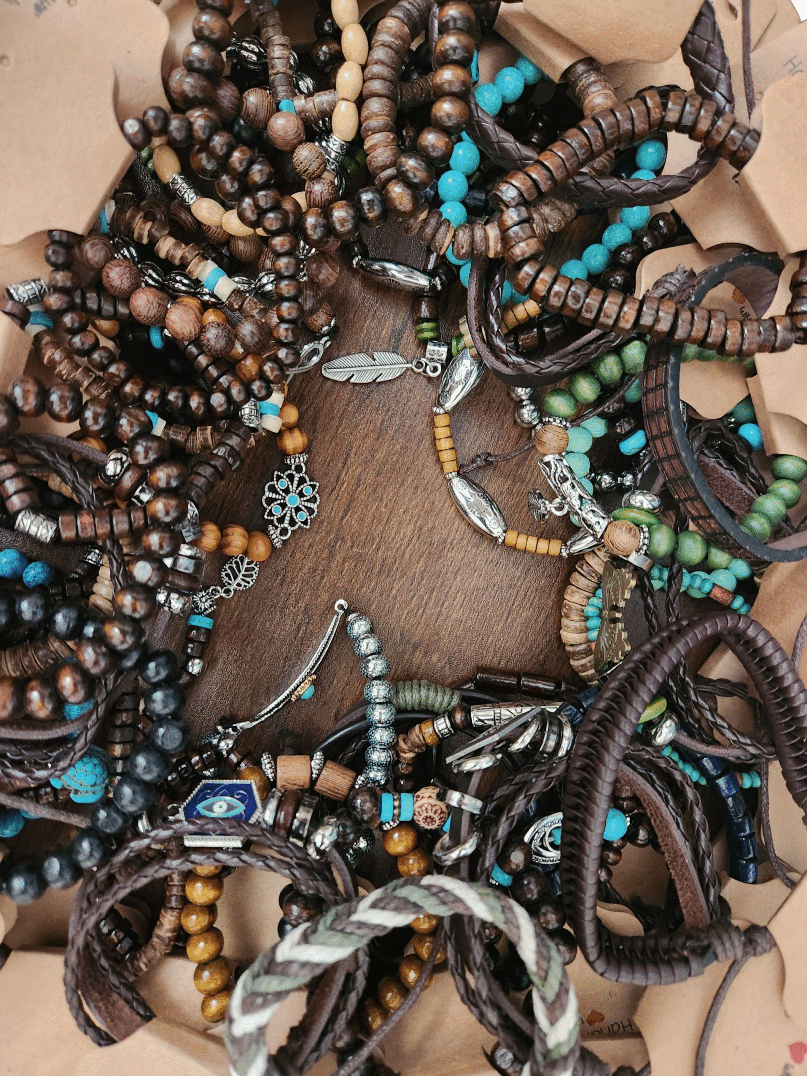A dense cluster of colorful beaded necklaces and bracelets.