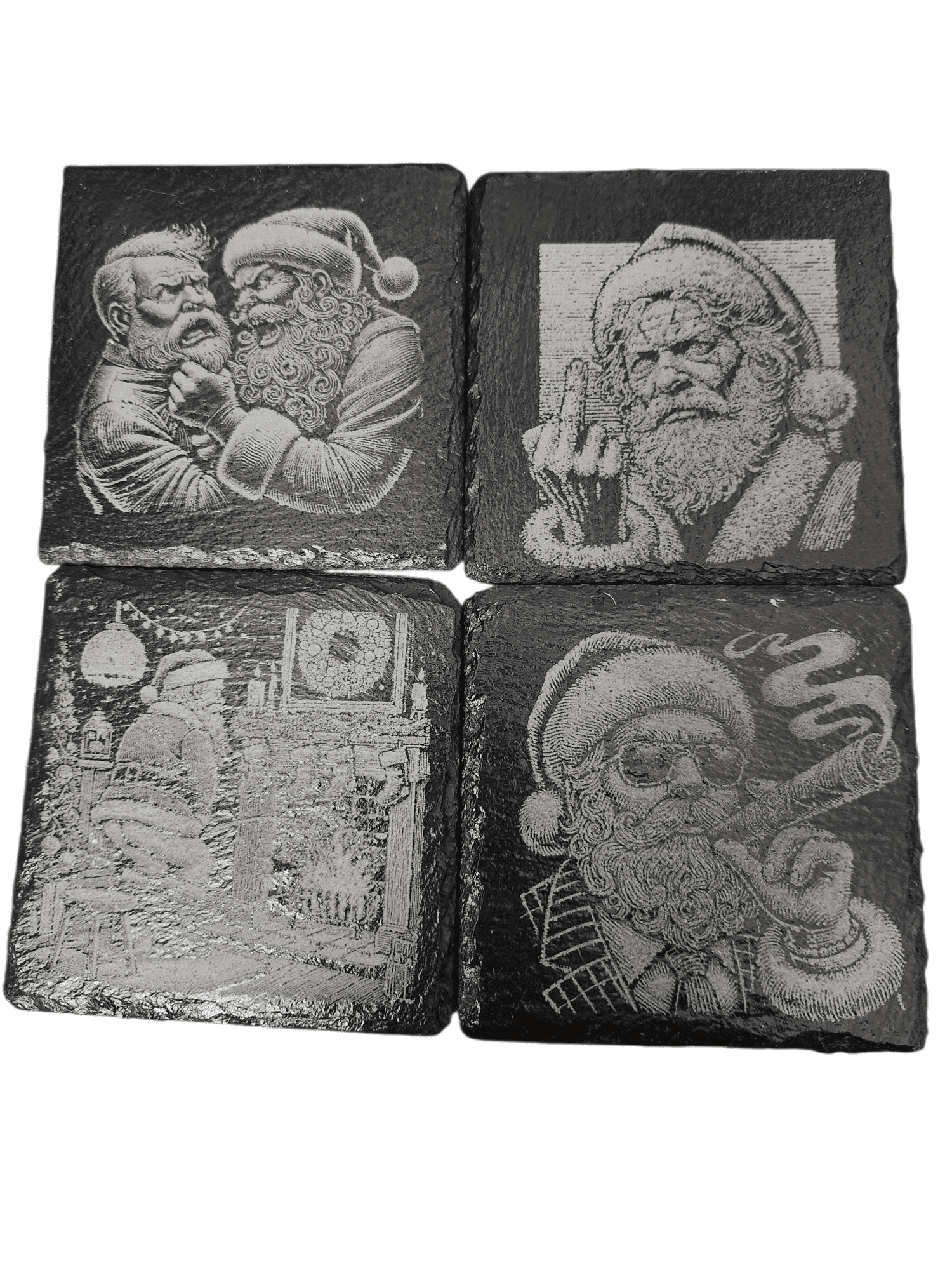 Four stone carvings of Santa Claus in various poses and styles.