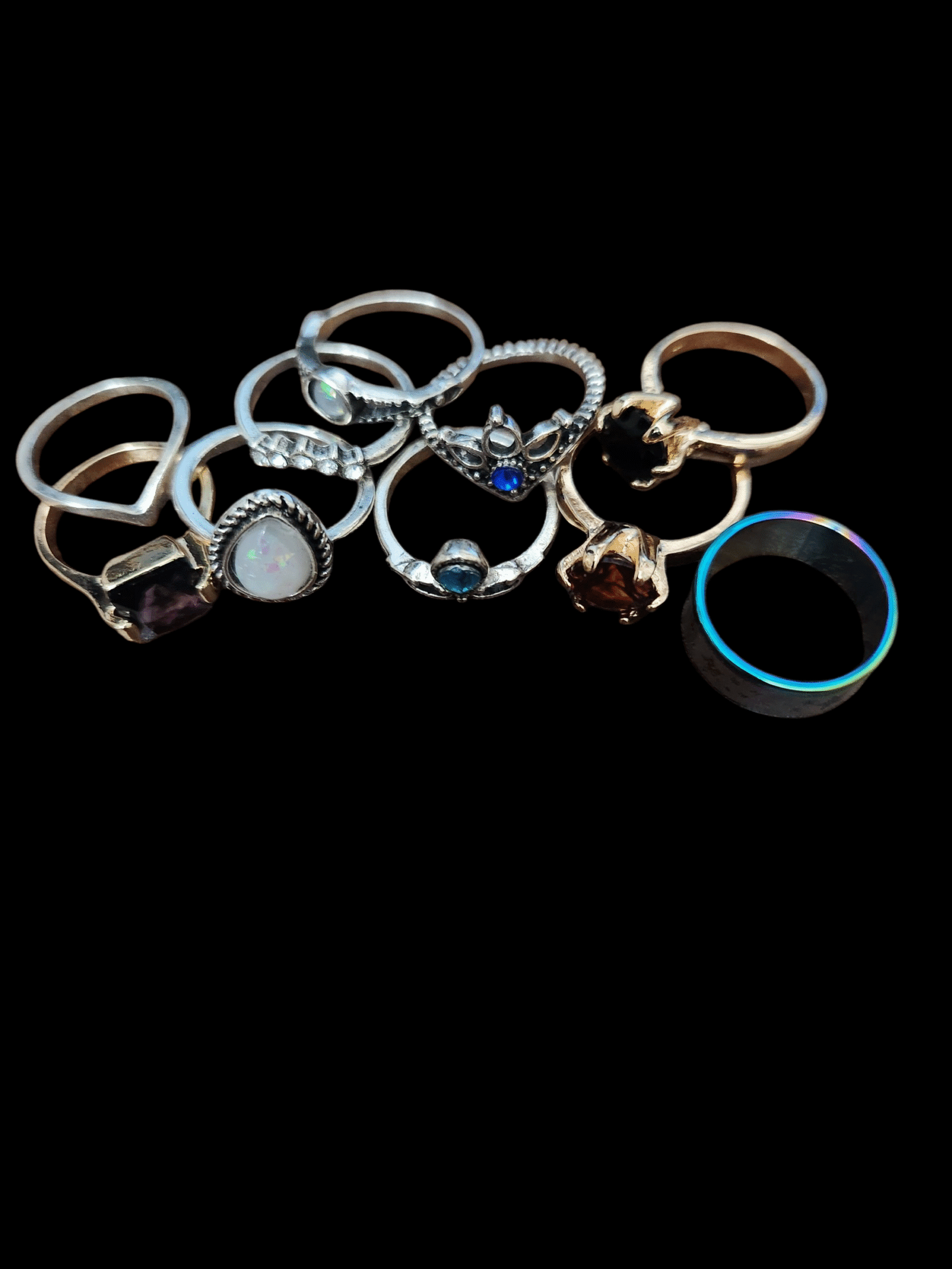 A collection of assorted rings with various designs and stones.