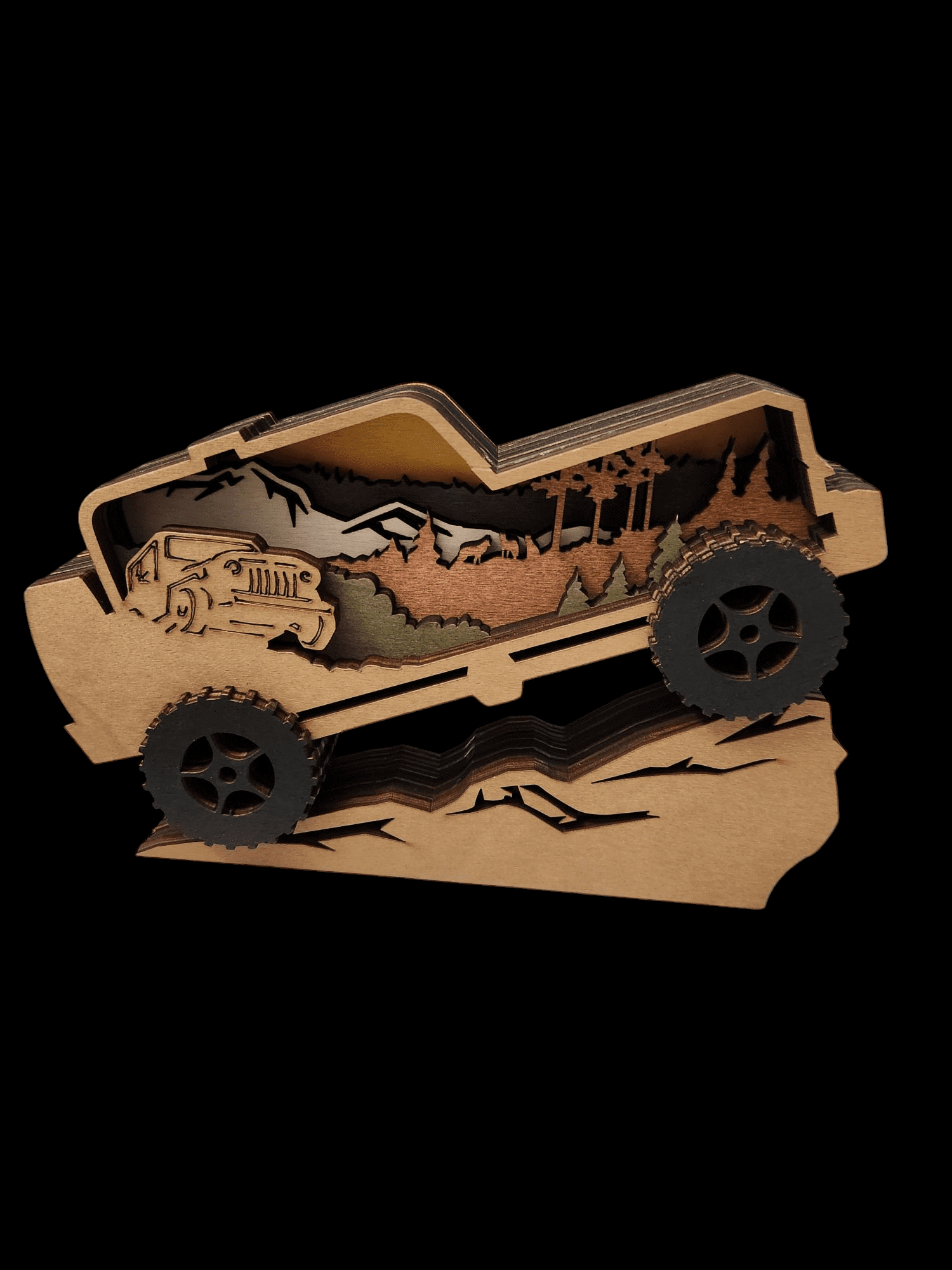 Wooden art of an off-road vehicle climbing a hill.
