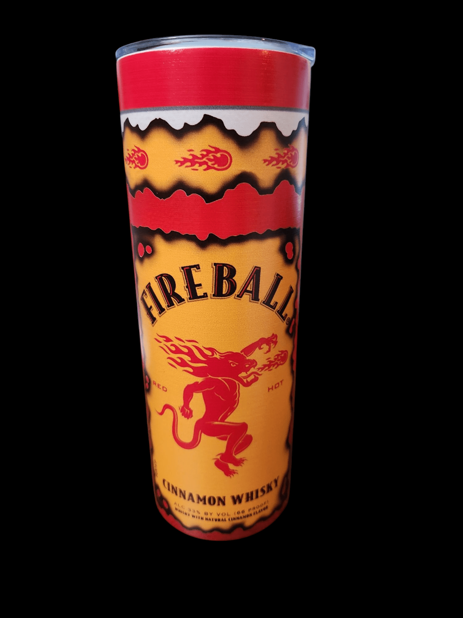 A red and yellow Fireball Cinnamon Whisky shot glass.