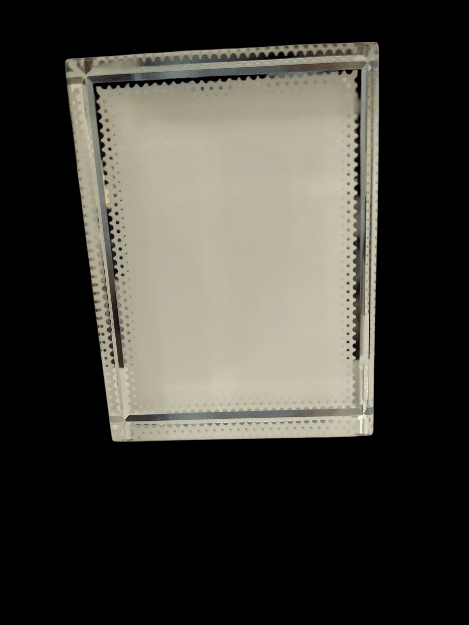 Ceiling-mounted rectangular light fixture with ventilation slots.