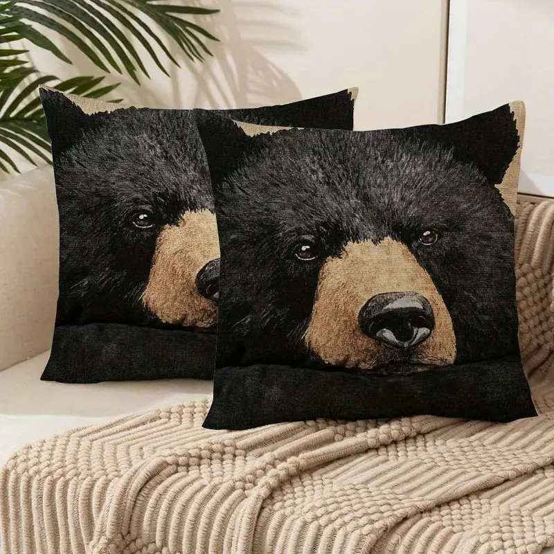 Decorative pillows featuring a close-up of a bear's face.