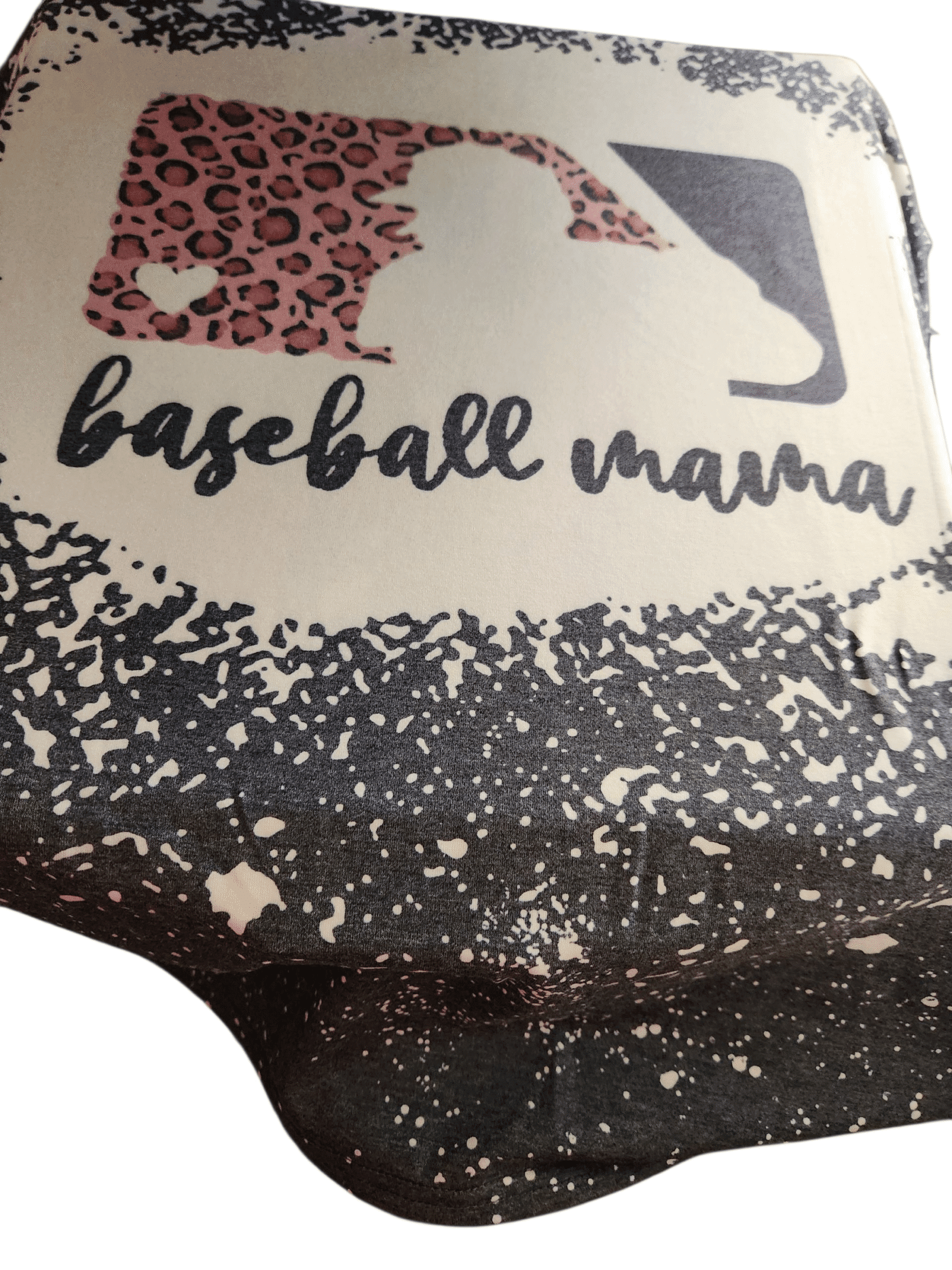 A close-up of a fabric with 'baseball mama' text and a leopard print design.