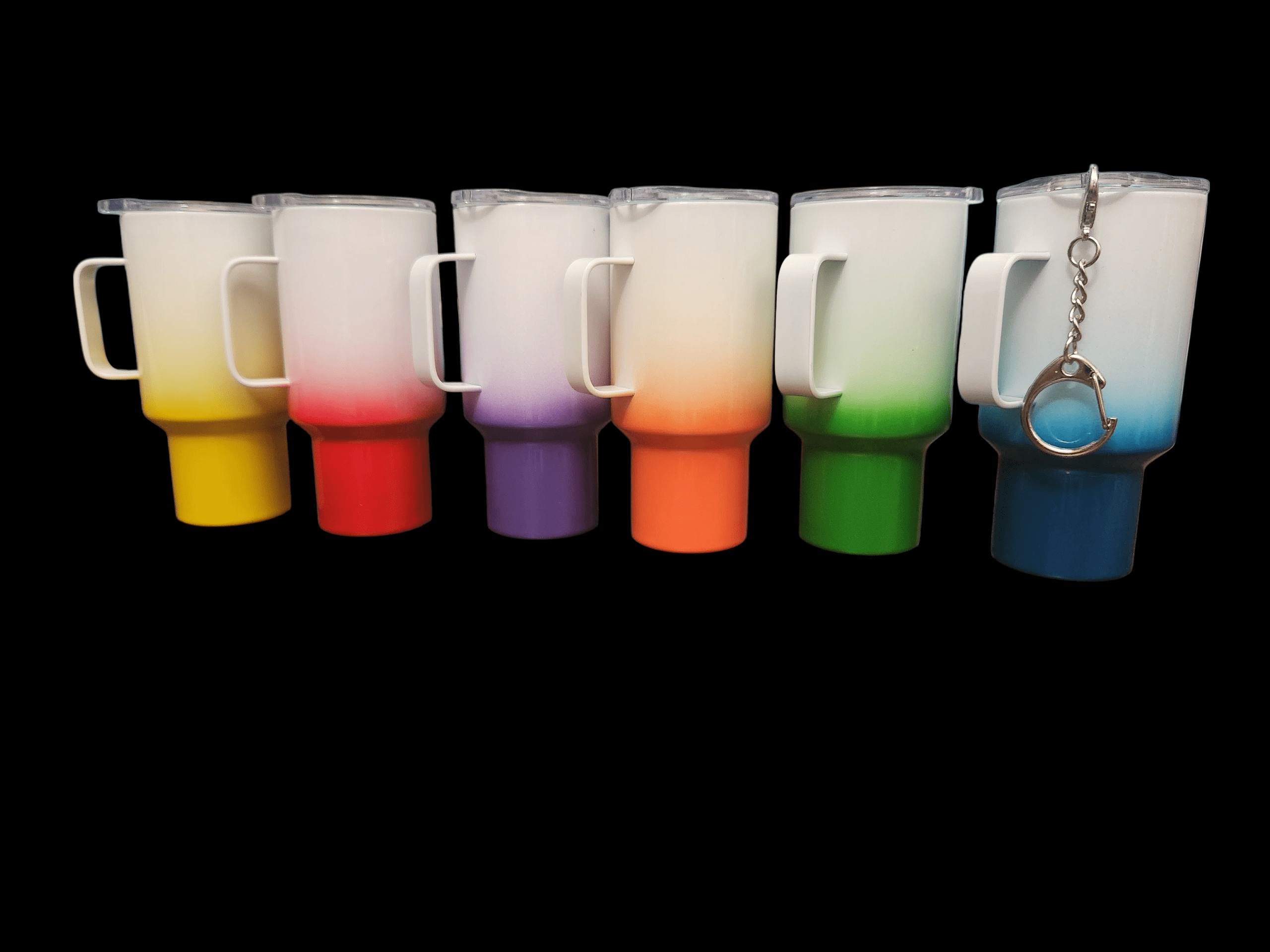 Colorful shot glasses with matching bases and keychains.