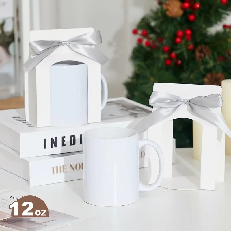 White ceramic mugs with bows, perfect holiday gifts.