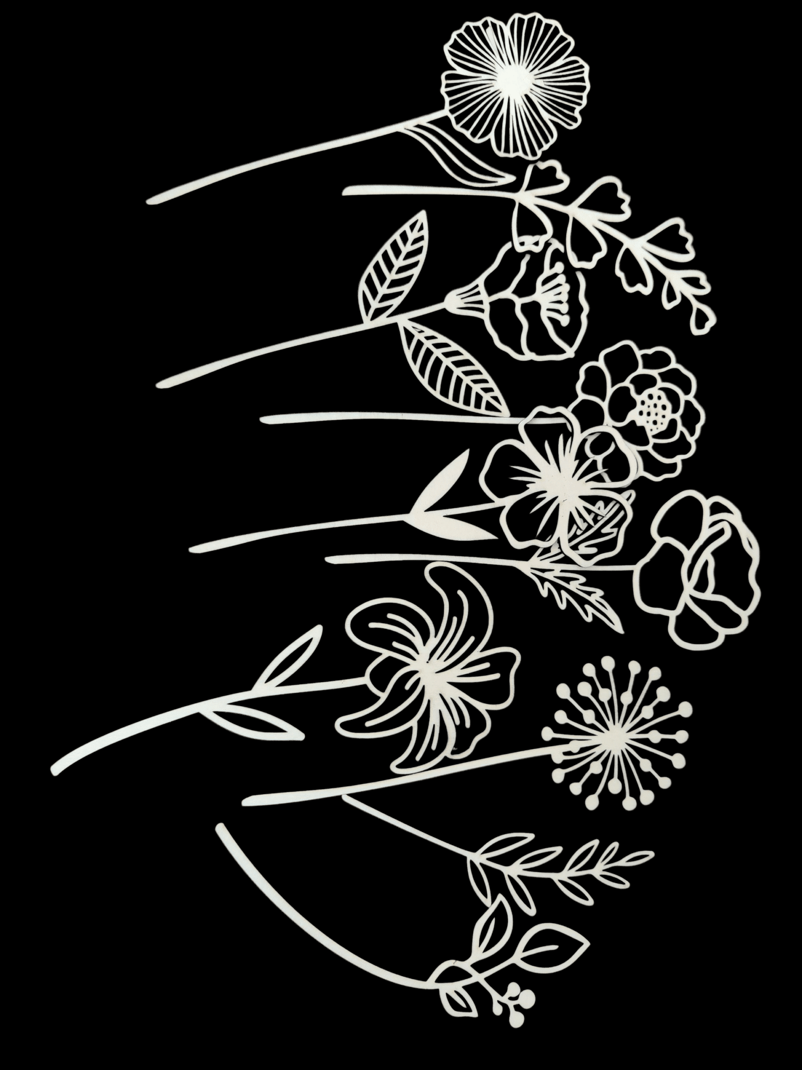 White floral line art on a black background.
