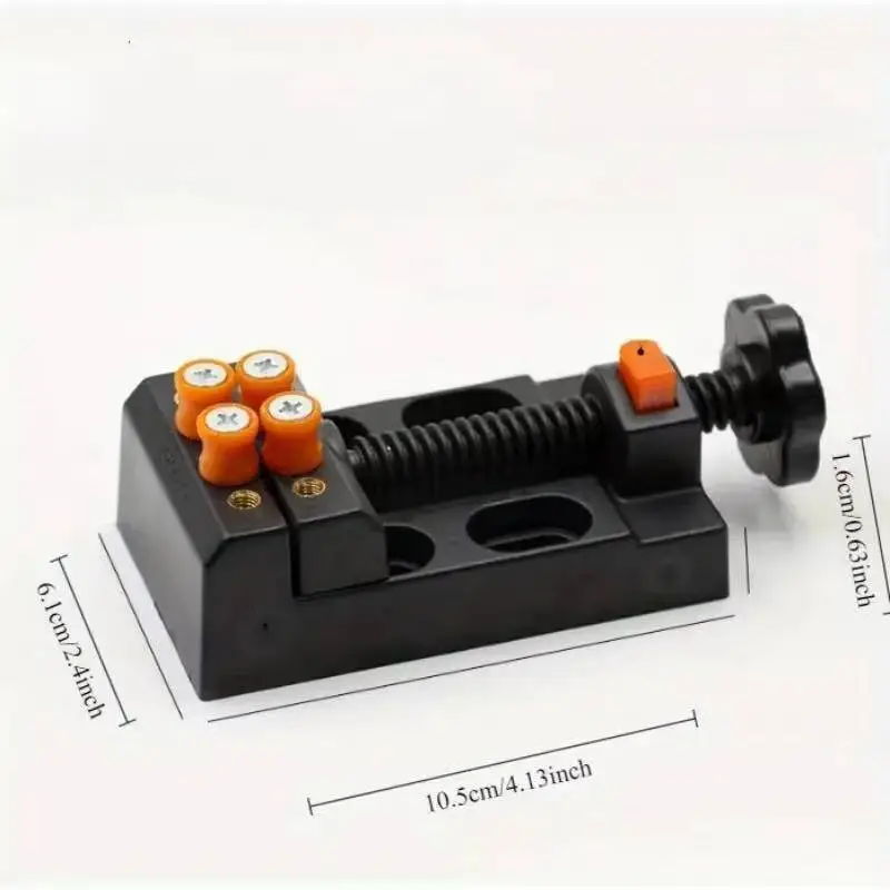 Compact desktop vise with adjustable jaws for holding small objects securely.