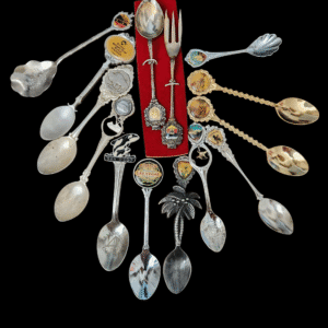 A collection of vintage silver spoons with intricate designs.