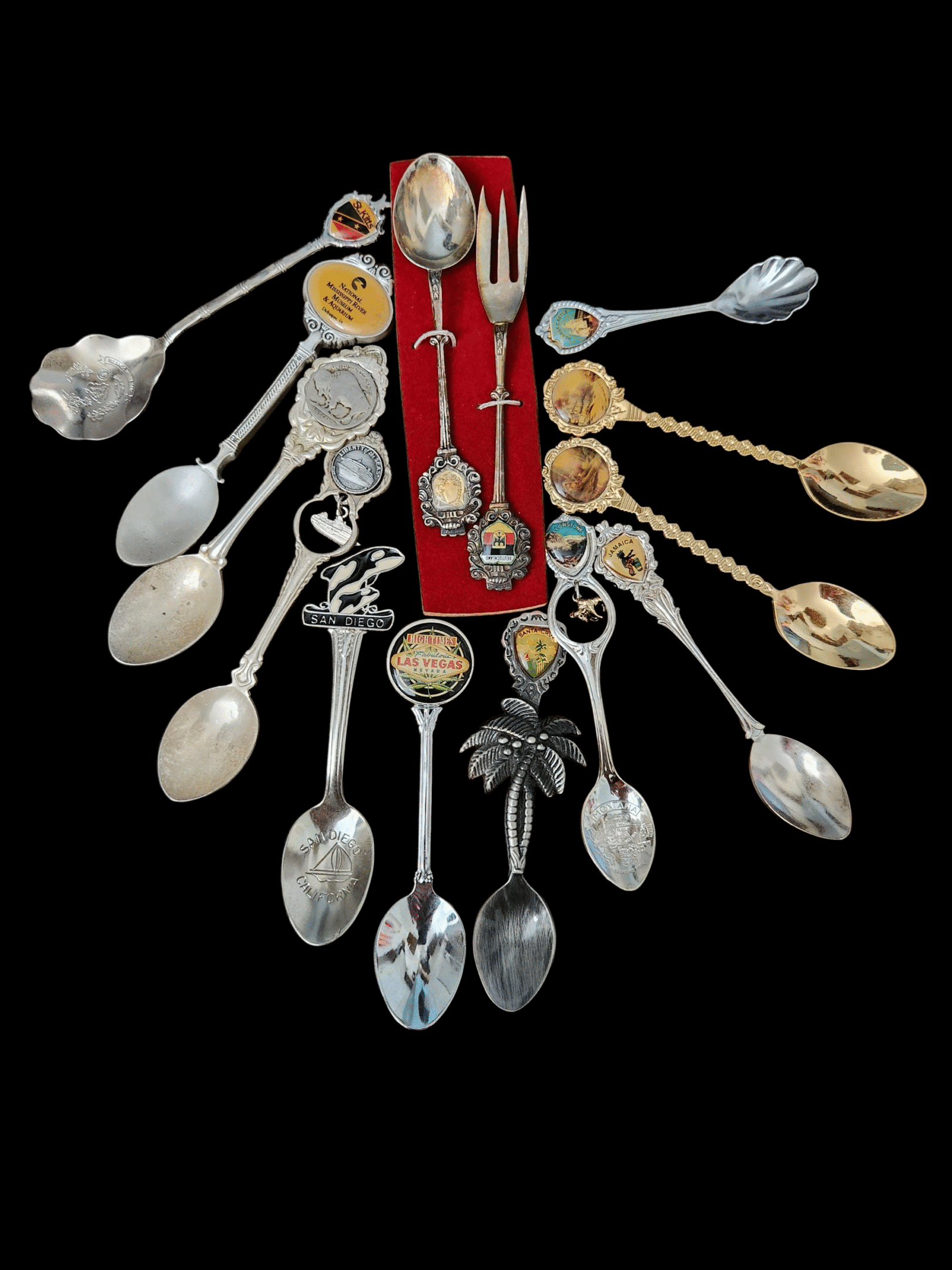 A collection of vintage silver spoons with intricate designs.