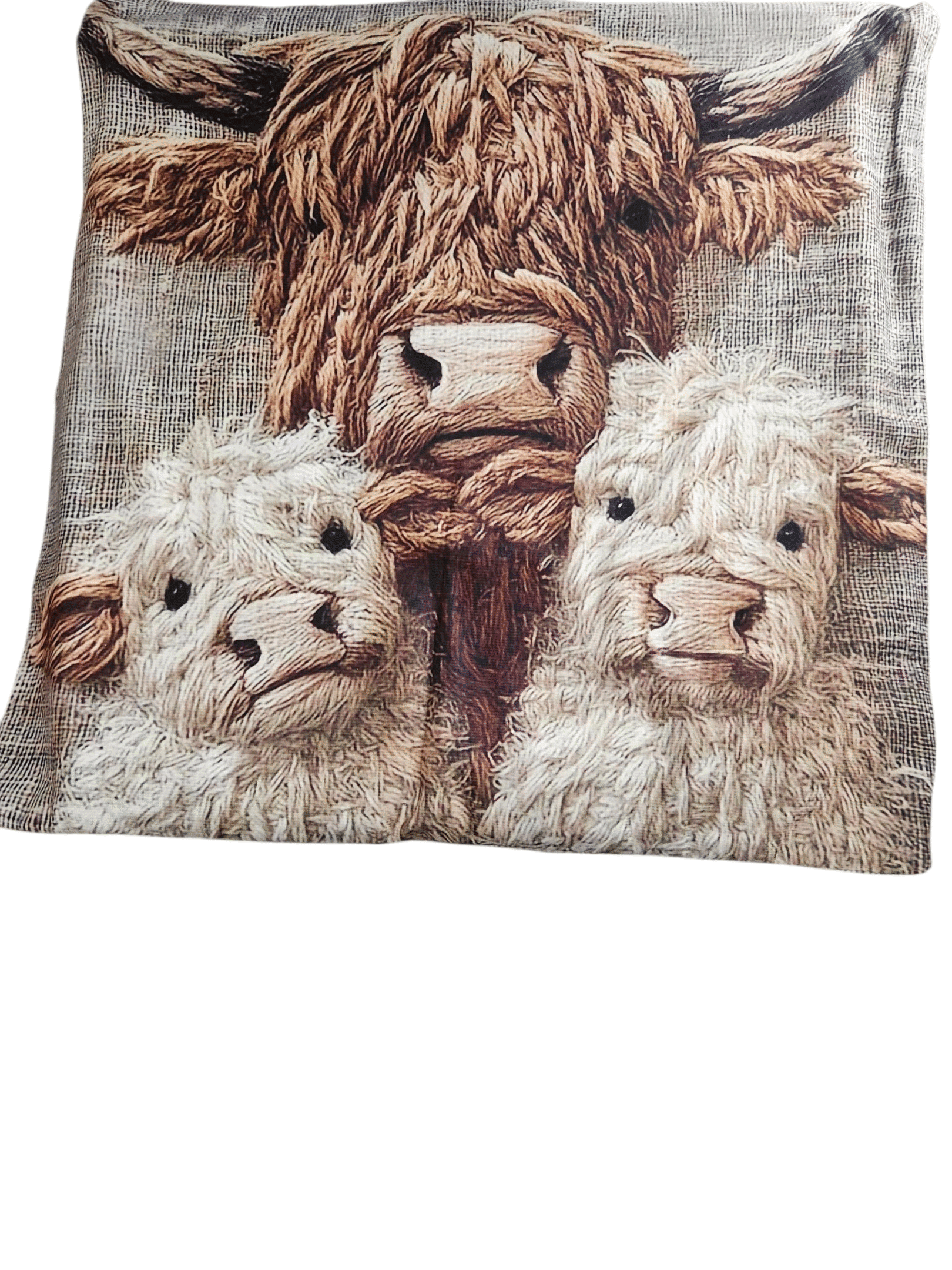 A soft textile featuring three adorable, fluffy sheep faces.