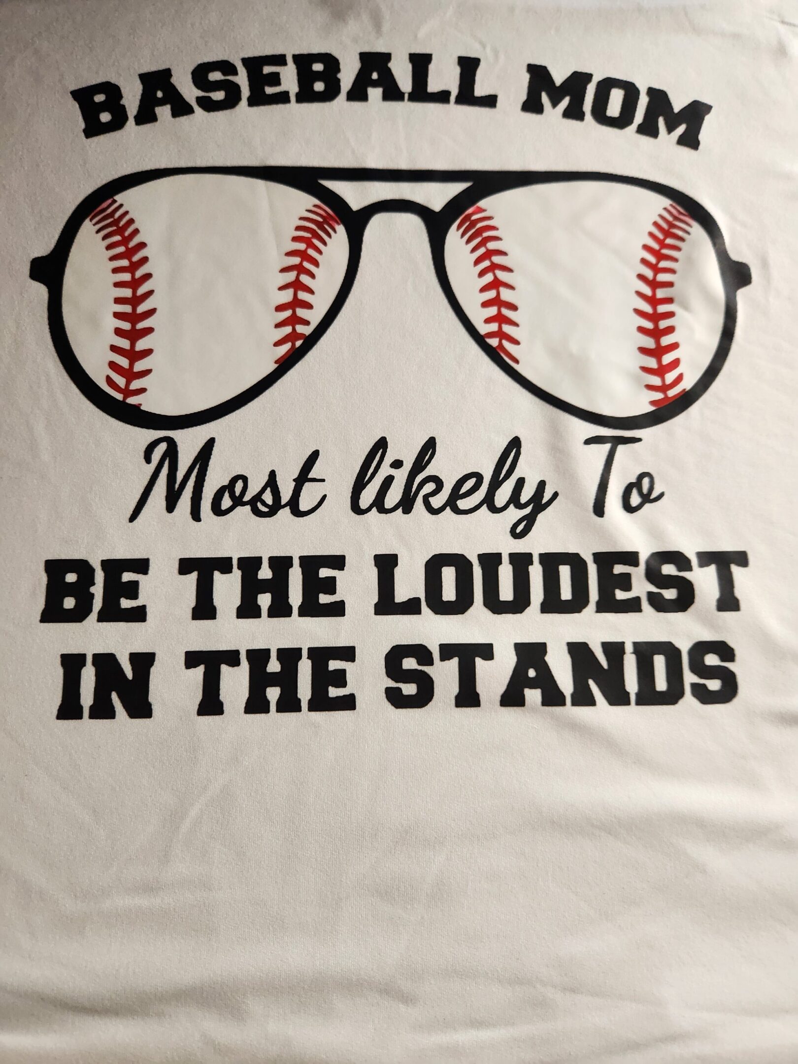 Glasses with baseballs as lenses and a loud fan quote.