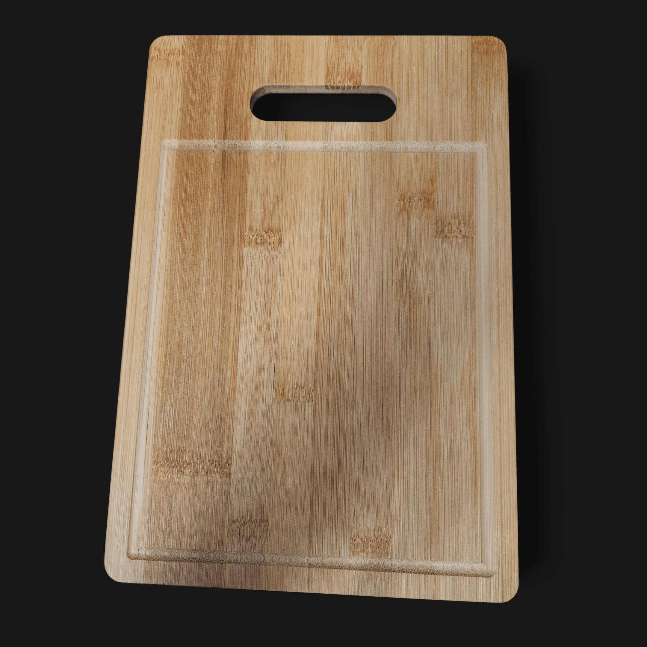 A wooden cutting board with a handle slot.